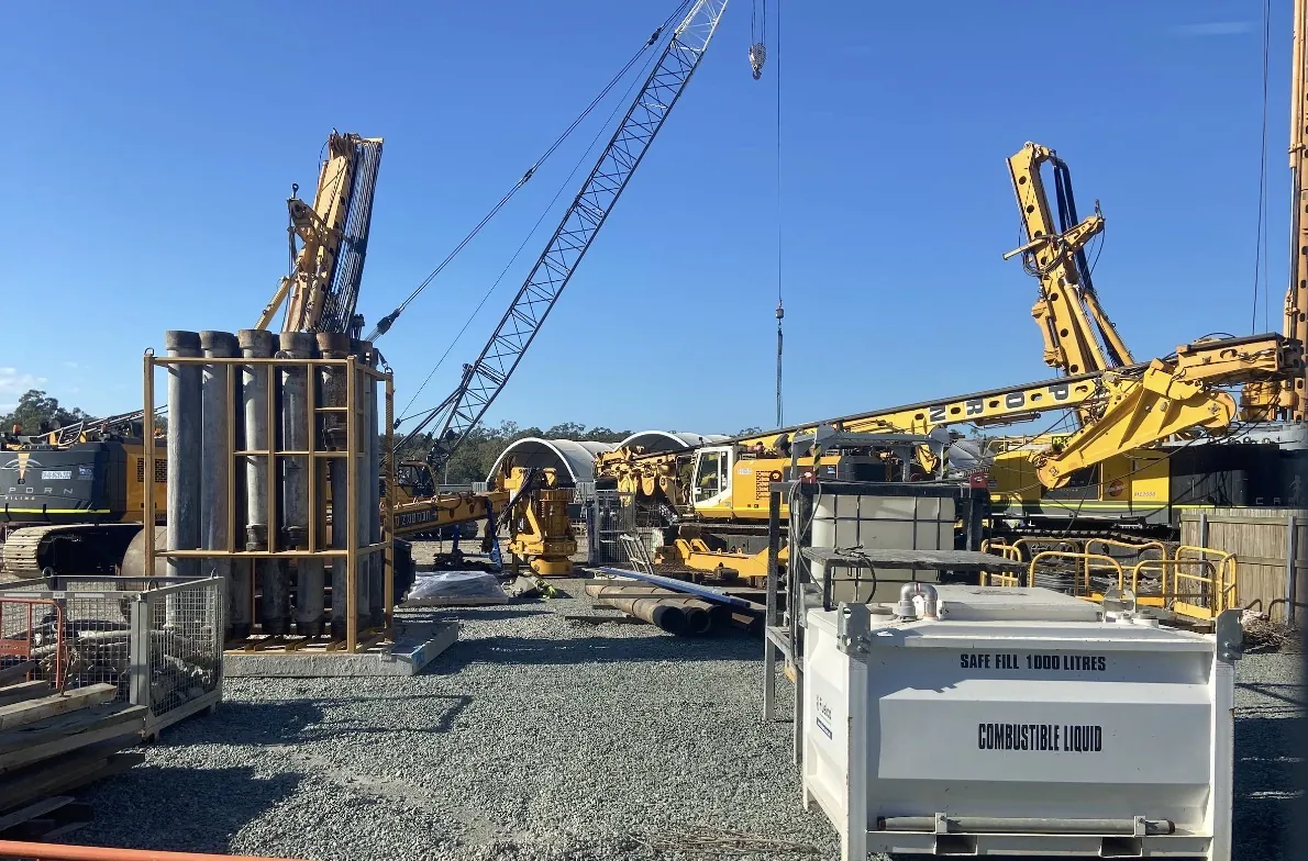 Cranes and piling rigs on site
