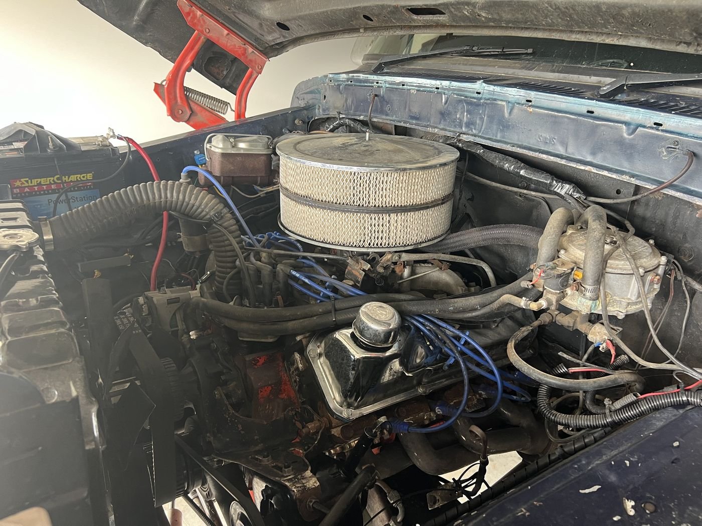V8 engine bay of a classic Ford Falcon under restoration in the workshop