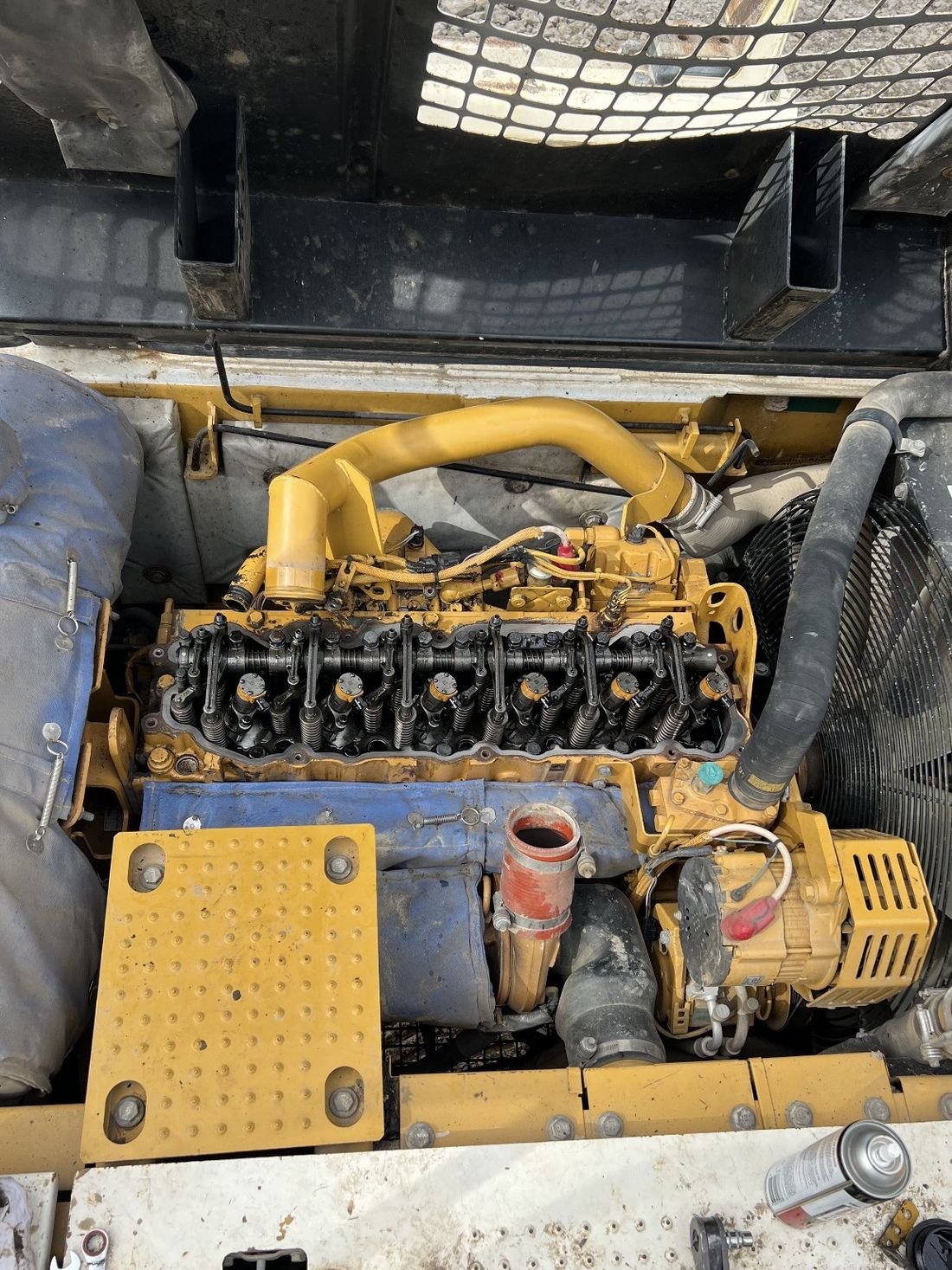 Caterpillar diesel engine with the valve cover removed during a heavy equipment overhaul