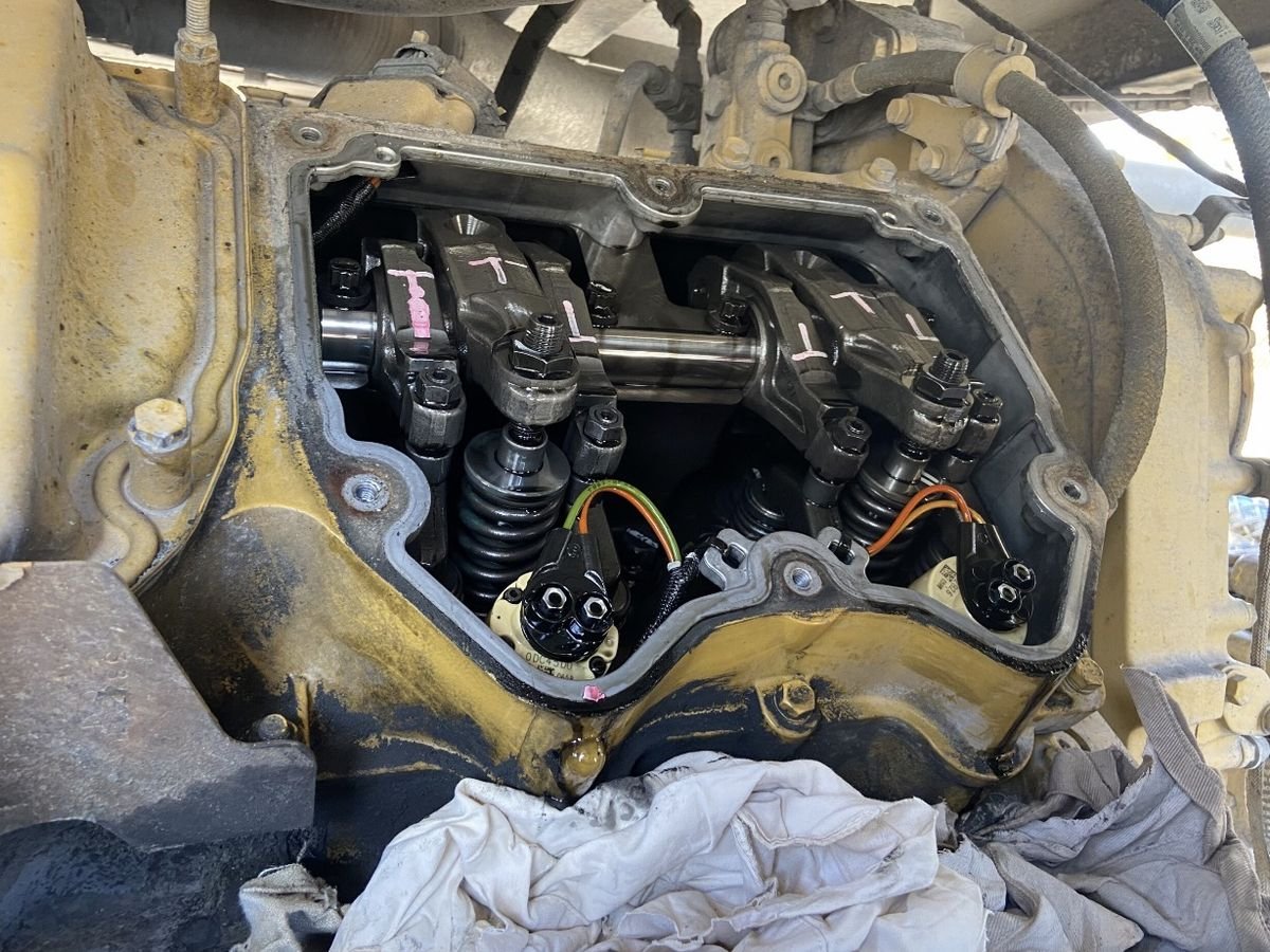 Open valve train and rocker gear on a diesel engine during a mechanical repair